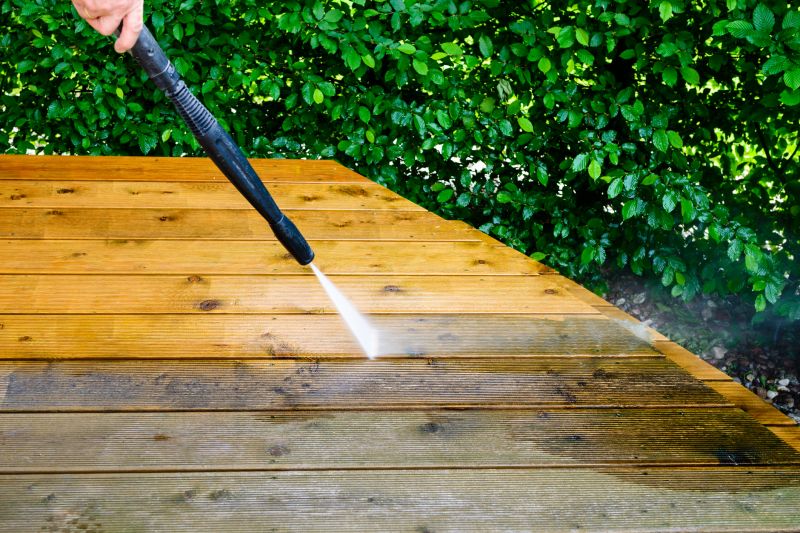 Power washing a deck surface